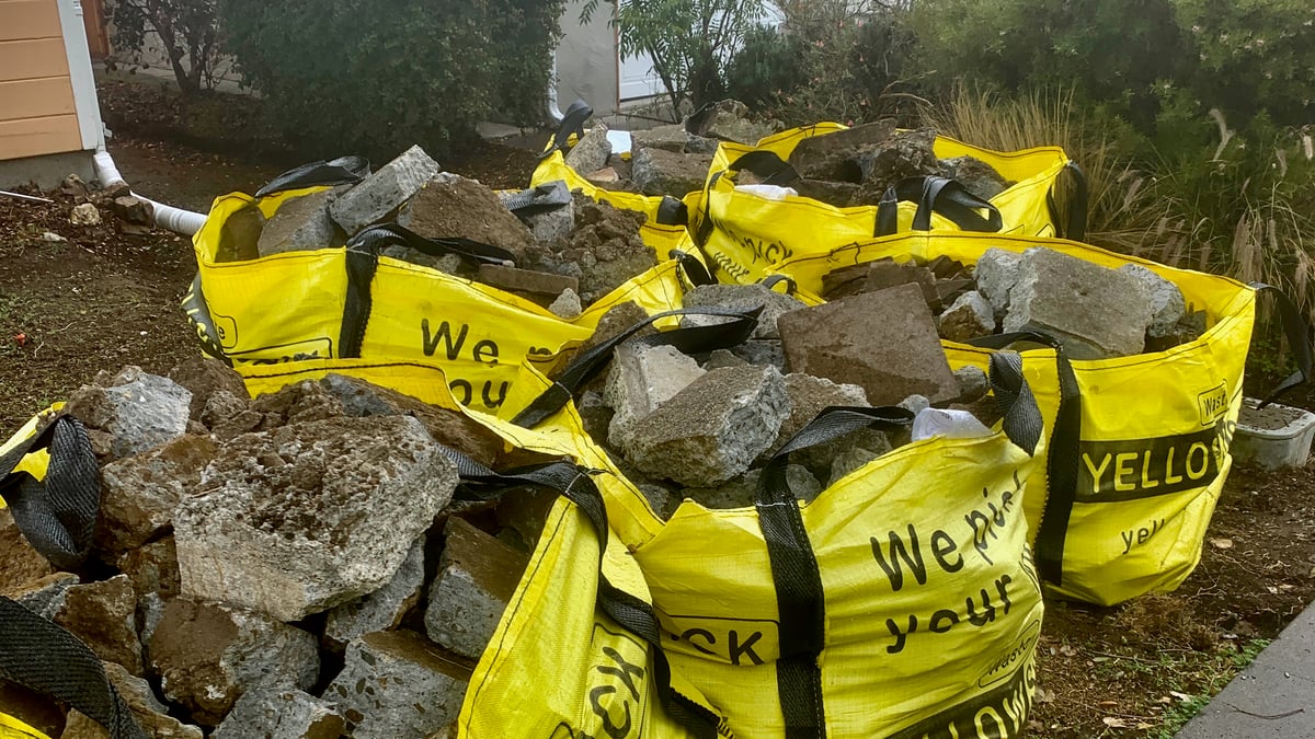 Medium Yellowsack, filled with concrete